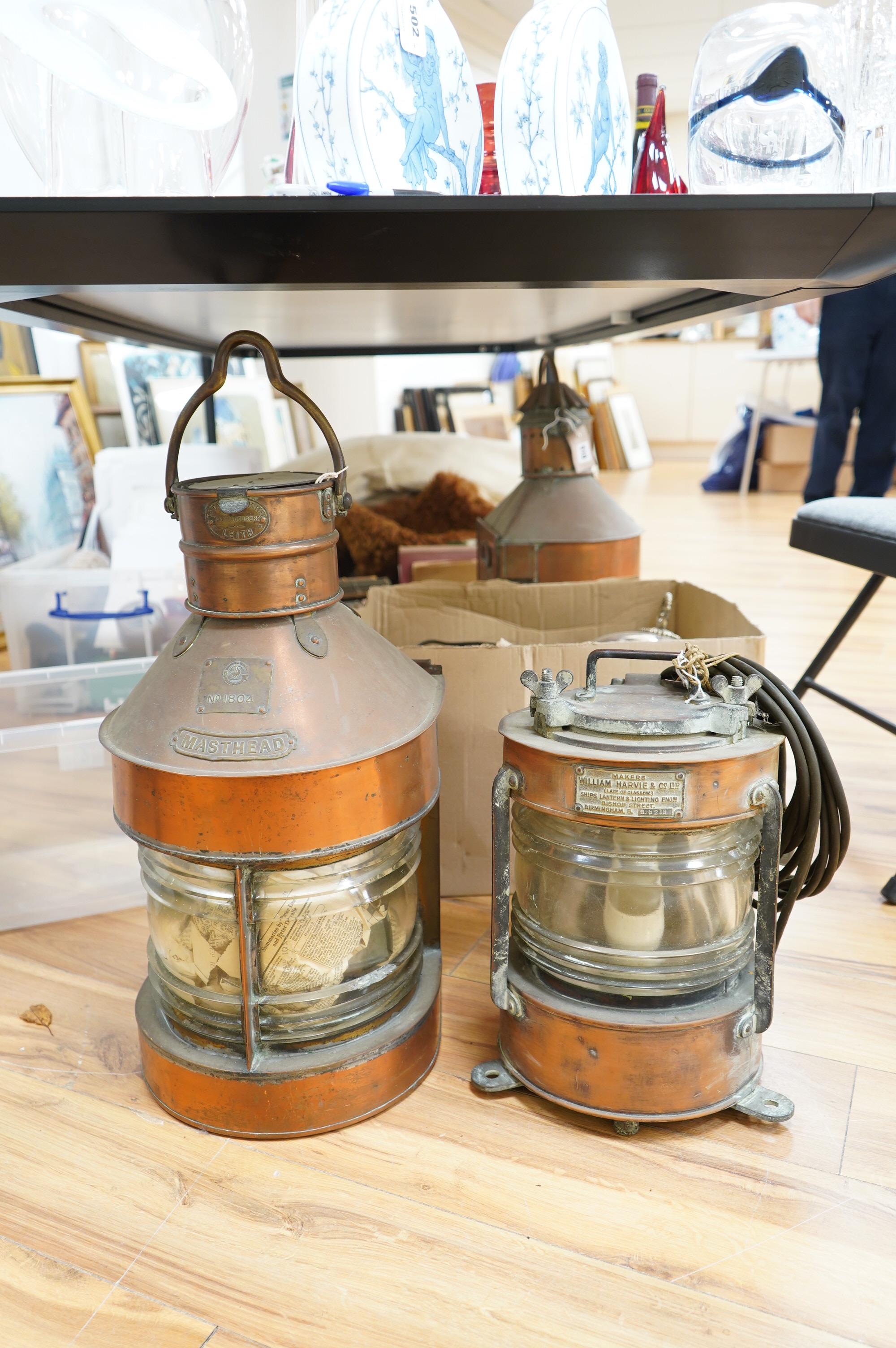 An early 20th century ship’s copper mast head lamp, and another copper ship’s lamp, largest 69cm high. Condition - fair